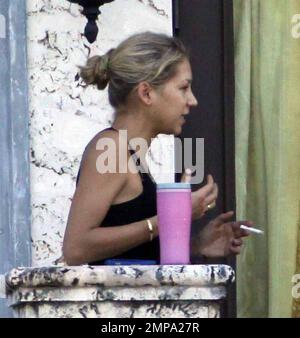 EXCLUSIVE!! Despite recent rumors of pregnancy, Anna Kournikova was spotted  on the balcony of her