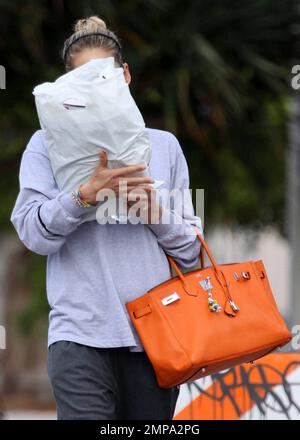 EXCLUSIVE!! Russian celebrity tennis pro Anna Kournikova hides her face as  she leaves the gym after a workout session. Anna, who according to reports  has earned in the past $11 million from