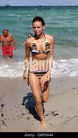 AnnaLynne McCord shows off her slender frame in a striped bikini. The 90201  actress took a dip in the warm Atlantic ocean after sunbathing in the 90  degrees Miami heat with sister