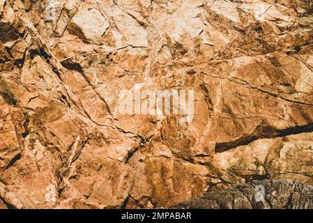 The texture of the rock, yellow, with various features. Stock Photo