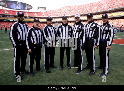 Officials pose before an NFL football game between the Los Angeles Rams and  the Las Vegas Raiders, Thursday, Dec. 8, 2022, in Inglewood, Calif. They  are, from left, replay official Bob Hubbell