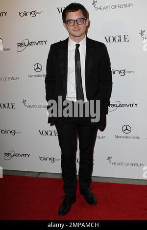 Elijah Wood in geek chic glasses on the red carpet at the star studded Art of Elysium fourth annual Heaven Charity Gala held at the California Science Center. Los Angeles, CA. 01/15/11. Stock Photo