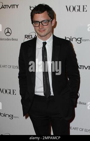 Elijah Wood in geek chic glasses on the red carpet at the star studded Art of Elysium fourth annual Heaven Charity Gala held at the California Science Center. Los Angeles, CA. 01/15/11. Stock Photo