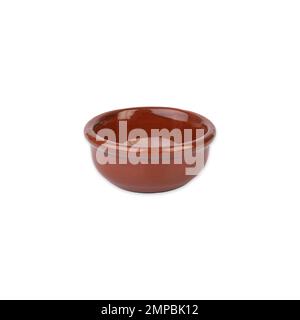 Rustic brown ceramic bowl isolated over white background. Stock Photo