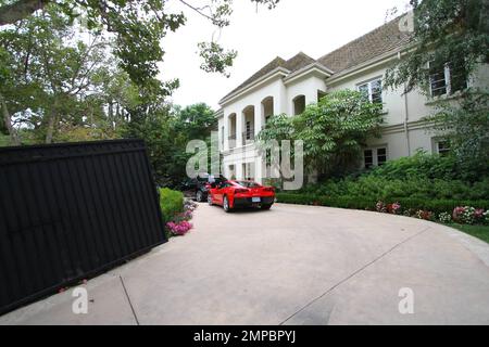 It’s been reported that rocker Avril Lavigne and husband Chad Kroeger have dished out $5.4 million dollars for this sprawling 7,888 square foot, French-style mansion in Los Angeles. According to reports, the couple, who tied the knot in the South of France in July of 2013, purchased the beautiful home that boasts 6 bedrooms, 7 1/2 bathrooms and sits on half an acre of land in Sherman Oaks as they make their move from Canada to L.A. The gorgeous estate also features a dramatic bridal staircase, vaulted ceilings, hand-carved fireplaces, a gourmet eat-in kitchen with 3 dishwashers, a gym, four Ju Stock Photo