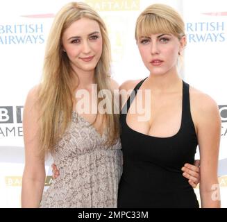 Madeline Zima (L) and sister Yvonne Zima walk the red carpet for the 8th Annual BAFTA/LA TV Tea Party held at the Hyatt Regency Hotel.  The annual party is hosted by The British Academy of Film and Television Arts to honor this year's US Emmy Award nominees. Los Angeles, CA. 08/28/10. Stock Photo