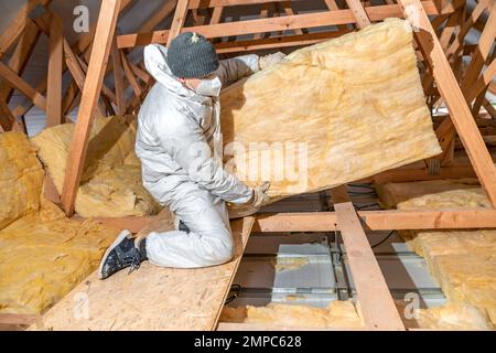 insulation of the roof and ceiling with glass wool Stock Photo