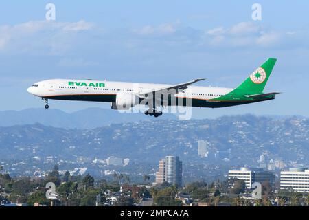 EVA Air Boeing 777 aircraft flying. Plane B777-300ER of Evergreen Airways. Airplane registered as B-16725. Stock Photo