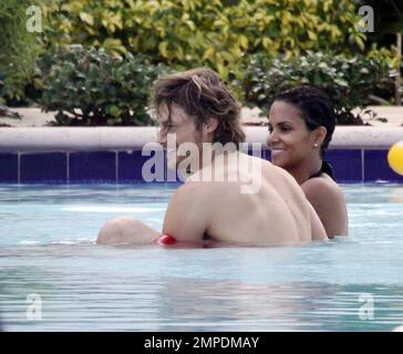 Halle Berry, Gabriel Aubry and their young daughter Nahla spend the afternoon at the pool. Miami, Fl. 7/7/09. Stock Photo