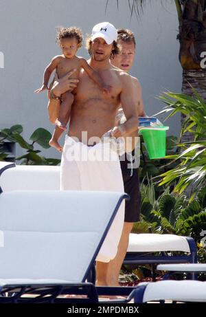 Halle Berry, Gabriel Aubry and their young daughter Nahla spend the afternoon at the pool. Miami, Fl. 7/7/09. Stock Photo