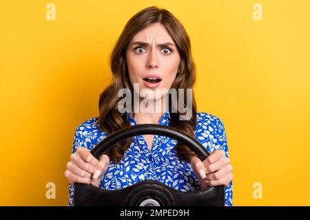 Photo of impressed shocked lady wear print shirt getting in crash driving automobile isolated yellow color background Stock Photo