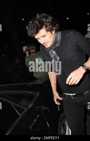 Actor Orlando Bloom continues his birthday celebrations with a night out on the town at Katusya in Los Angeles with his Victorias Secret model girlfriend Miranda Kerr.  The couple left amongst a throng of photographers but managed smiles for all.  They left in Blooms BMW v10 saloon that is in need of a good wash.  Lord of the Rings and Pirates of the Caribbean star Bloom turned 32 on January 13th.  Los Angeles, CA. 1/14/09. Stock Photo