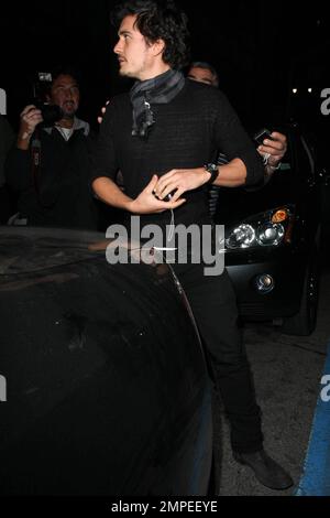 Actor Orlando Bloom continues his birthday celebrations with a night out on the town at Katusya in Los Angeles with his Victorias Secret model girlfriend Miranda Kerr.  The couple left amongst a throng of photographers but managed smiles for all.  They left in Blooms BMW v10 saloon that is in need of a good wash.  Lord of the Rings and Pirates of the Caribbean star Bloom turned 32 on January 13th.  Los Angeles, CA. 1/14/09. Stock Photo