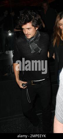 Actor Orlando Bloom continues his birthday celebrations with a night out on the town at Katusya in Los Angeles with his Victorias Secret model girlfriend Miranda Kerr.  The couple left amongst a throng of photographers but managed smiles for all.  They left in Blooms BMW v10 saloon that is in need of a good wash.  Lord of the Rings and Pirates of the Caribbean star Bloom turned 32 on January 13th.  Los Angeles, CA. 1/14/09. Stock Photo