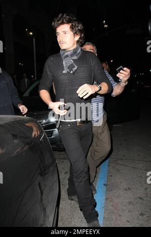 Actor Orlando Bloom continues his birthday celebrations with a night out on the town at Katusya in Los Angeles with his Victorias Secret model girlfriend Miranda Kerr.  The couple left amongst a throng of photographers but managed smiles for all.  They left in Blooms BMW v10 saloon that is in need of a good wash.  Lord of the Rings and Pirates of the Caribbean star Bloom turned 32 on January 13th.  Los Angeles, CA. 1/14/09. Stock Photo