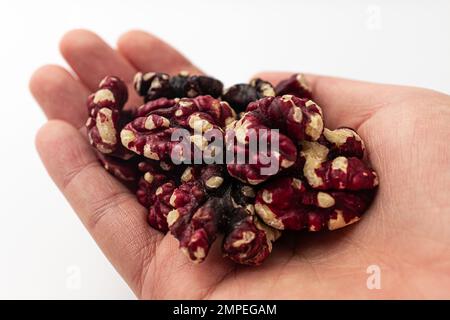 Red walnuts on a white background Stock Photo