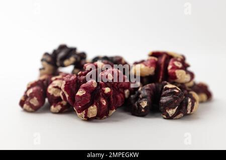 Red walnuts on a white background Stock Photo