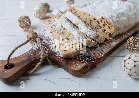 Christmas Stollen from Dresden. Traditional German christmas fruit bread on wooden table Stock Photo