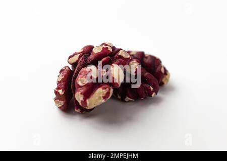 Red walnuts on a white background Stock Photo