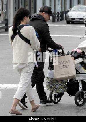 Actress Selma Blair is seen carrying her four month old son Arthur along with fashion designer boyfriend Jason Bleick who was pushing the baby stroller at the Malibu Country Mart where they did some shopping. It's been recently reported that the 'Cruel Intentions' star is suffering from post-partum hair loss, an unwanted side affect of pregnancy. She stated, 'This is so not glamorous, but itÕs true: I need to take longer showers so that I can collect the hair that falls out and throw it away so I donÕt clog the drain. Why do actresses never talk about that?' She continued with, 'It just starte Stock Photo