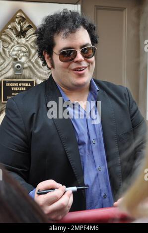 Josh Gad signs autographs for fans after a complimentary fan performance of 'Book of Mormon.' This performance was his last with the show. He is leaving to continue production of a television pilot picked up by NBC for the fall season. New York, NY. 6th June 2012. Stock Photo