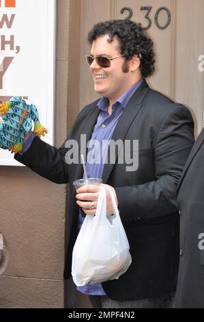 Josh Gad signs autographs for fans after a complimentary fan performance of 'Book of Mormon.' This performance was his last with the show. He is leaving to continue production of a television pilot picked up by NBC for the fall season. New York, NY. 6th June 2012. . Stock Photo