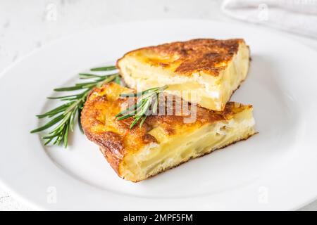 Traditional Spanish tortilla omelette made with eggs and potatoes Stock Photo