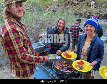 Far & Away Adventures guides preparing dinner on the Bruneau River in Idaho. Stock Photo