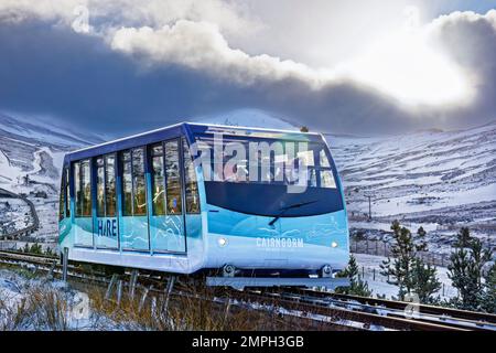 Cairngorm Mountain Funicular Railway Aviemore Scotland snow covered hills and the Hare with passengers Stock Photo