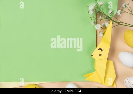Happy Easter - layout with space for text, Easter bunny made of origami paper, top view Stock Photo