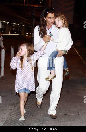 Brooke Shields arrives at LAX with her two adorable daughters Rowan and Grier. Rowan was sporting braids in her hair while the younger Grier got a ride with mom. Los Angeles, Ca. 6/20/09. Stock Photo