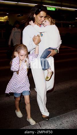 Brooke Shields arrives at LAX with her two adorable daughters Rowan and Grier. Rowan was sporting braids in her hair while the younger Grier got a ride with mom. Los Angeles, Ca. 6/20/09. Stock Photo