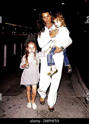 Brooke Shields arrives at LAX with her two adorable daughters Rowan and Grier. Rowan was sporting braids in her hair while the younger Grier got a ride with mom. Los Angeles, Ca. 6/20/09. . Stock Photo