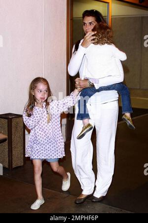 Brooke Shields arrives at LAX with her two adorable daughters Rowan and Grier. Rowan was sporting braids in her hair while the younger Grier got a ride with mom. Los Angeles, Ca. 6/20/09. . Stock Photo