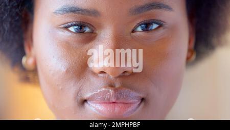Confident and proud black woman smiling, showing strength and dignity. Closeup of the face and head of a beautiful young african american female Stock Photo