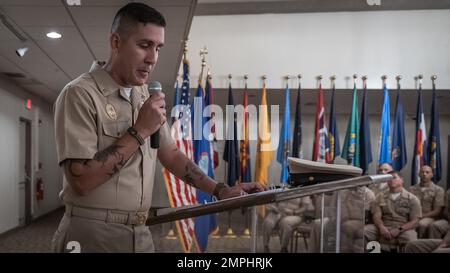 NAVAL BASE GUAM (Oct. 24, 2022) Sailors, civilians, and military families  gathered to witness the initiation of several of the region's newest chief  petty officers during a pinning ceremony at Top o'