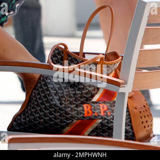 EXCLUSIVE!! 'Cougar Town' star Busy Philipps chats with actress Lauren Graham outside a local gym. Busy's handbag, which has her initials printed on it, sat on a chair next to her. West Hollywood, CA. 1st August 2012. Stock Photo