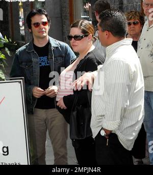 A heavily pregnant Carnie Wilson with hubby Rob Bonfiglio lunches at the Ivy in Los Angeles, Ca. Wilson has only 4 weeks to go until she gives birth to the couple's first child which is expected to be a girl called Lola. 4/14/05 Stock Photo