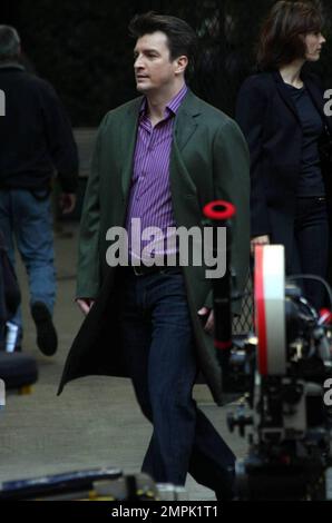 Nathan Fillion and Stana Katic film a scene on the set of "Castle" in