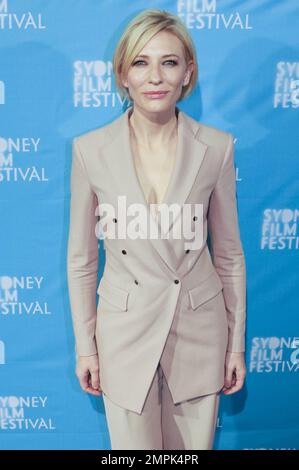 Cate Blanchett wears a blush Giorgio Armani double-breasted suit to the