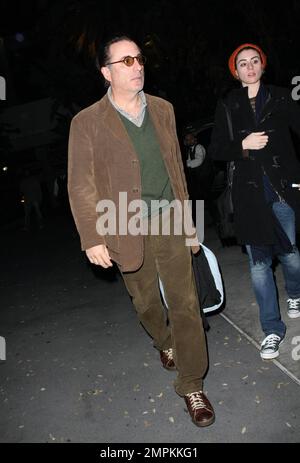 Exclusive!! Actor Andy Garcia arrives at the Staples Center to attend the Lakers Game and stops to sign autographs for fans. Los Angeles, CA. 1/20/09. Stock Photo