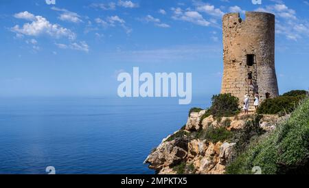 tourists visiting Cap Blanc tower built in 1579, llucmajor, Mallorca, Balearic Islands, Spain Stock Photo