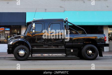 EXCLUSIVE!! Cincinnati Bengals Wide Receiver Chad Ochocinco parallel parks his custom Extreme Ford F650 Super Truck near David's Cafe just off of South Beach's popular Lincoln Road. Ochocinco spent some time shopping and having lunch with fiance Evelyn Lozada. Miami Beach, FL. 2/22/11. Stock Photo