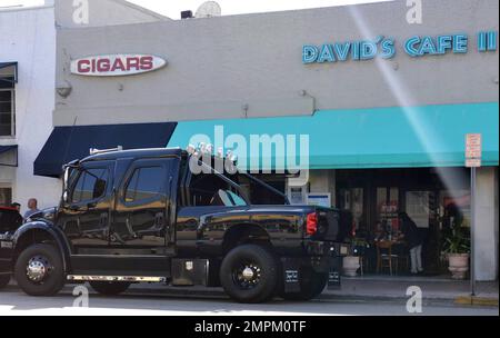 EXCLUSIVE!! Cincinnati Bengals Wide Receiver Chad Ochocinco parallel parks his custom Extreme Ford F650 Super Truck near David's Cafe just off of South Beach's popular Lincoln Road. Ochocinco spent some time shopping and having lunch with fiance Evelyn Lozada. Miami Beach, FL. 2/22/11. Stock Photo