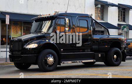 EXCLUSIVE!! Cincinnati Bengals Wide Receiver Chad Ochocinco parallel parks his custom Extreme Ford F650 Super Truck near David's Cafe just off of South Beach's popular Lincoln Road. Ochocinco spent some time shopping and having lunch with fiance Evelyn Lozada. Miami Beach, FL. 2/22/11. Stock Photo