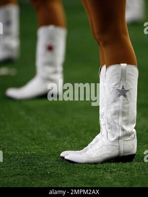 The Dallas Cowboys Cheerleaders, wearing special red striped boots in honor  of NFL Salute to Service, perform during an NFL football game in Arlington,  Texas, Sunday, Nov. 7, 2021. (AP Photo/Ron Jenkins