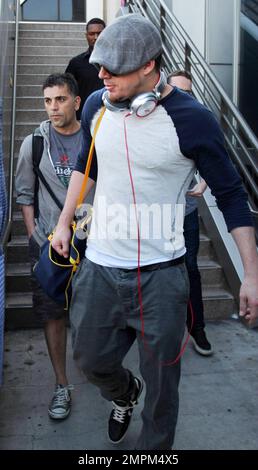 'White House Down' star Channing Tatum was spotted arriving at LAX airport. The 33 year old actor dressed casual in a grey hat with dark shades, tan patterned shirt and grey pants. Los Angeles, CA. 23rd August 2013. Stock Photo