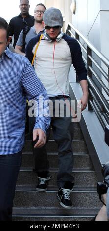 'White House Down' star Channing Tatum was spotted arriving at LAX airport. The 33 year old actor dressed casual in a grey hat with dark shades, tan patterned shirt and grey pants. Los Angeles, CA. 23rd August 2013. Stock Photo