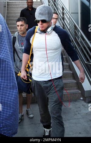 'White House Down' star Channing Tatum was spotted arriving at LAX airport. The 33 year old actor dressed casual in a grey hat with dark shades, tan patterned shirt and grey pants. Los Angeles, CA. 23rd August 2013. Stock Photo