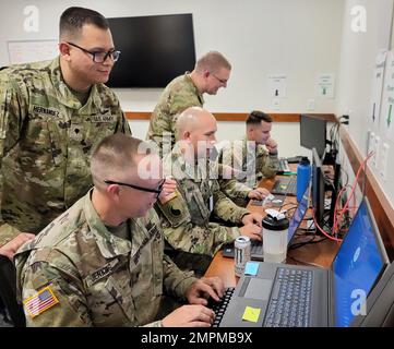 Soldiers from Army Space Support Team 22 with the 1158th Space Company, 117th Space Battalion, 1st Space Brigade, conduct a Table VIII certification at the 117th Readiness Facility on Fort Carson, Colorado, Nov. 4, 2022. From left are: Spc. Andy Hernandez-Solorio, Spc. Ryan Jenkins, Capt. Adam Smiley, Maj. Christopher Kremer, and Staff Sgt. Donovan Olson. Soldiers from the 1st Space Brigade provided space capabilities during  the Army's Project Convergence 2022, which took place across the Western United States from September to November.  (U.S. Army photo) Stock Photo